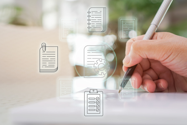 Document Report and business data system business HR technology Concept: Businessman Manager hands holding pen for checking and signing white documents reports papers of files icon in modern office