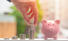 Piggy Bank With Stack of Coins,Male Hand Saving Money concept